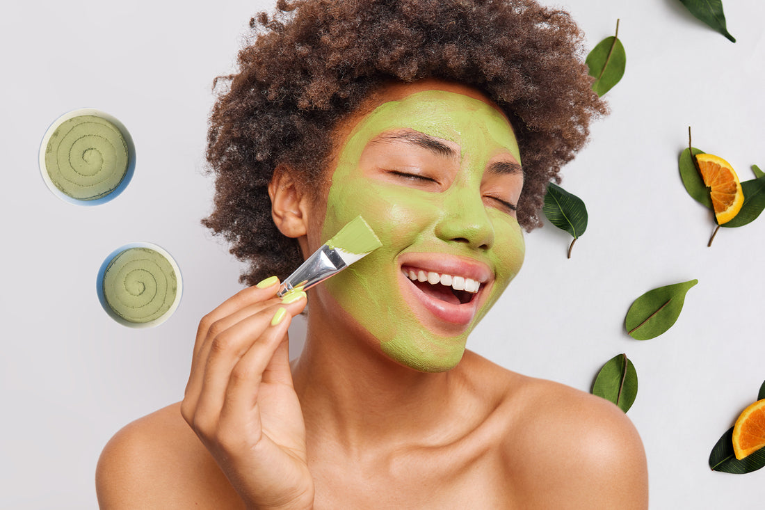 Woman with green clay facial mask