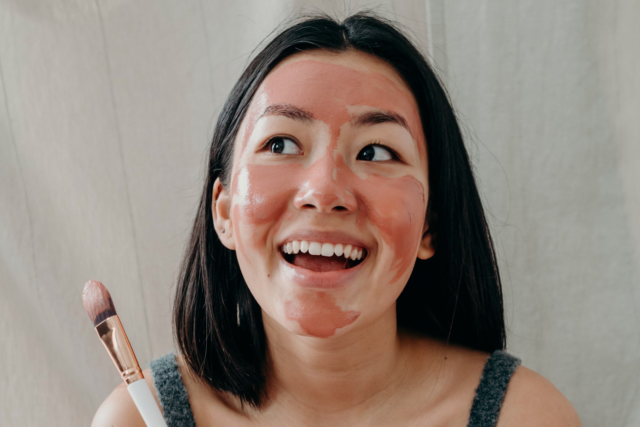 Woman with a Red clay homemade facial mask