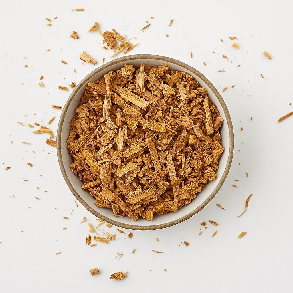 Top view of dried Borututu bark in a ceramic bowl on a light background – herbal root tea cut