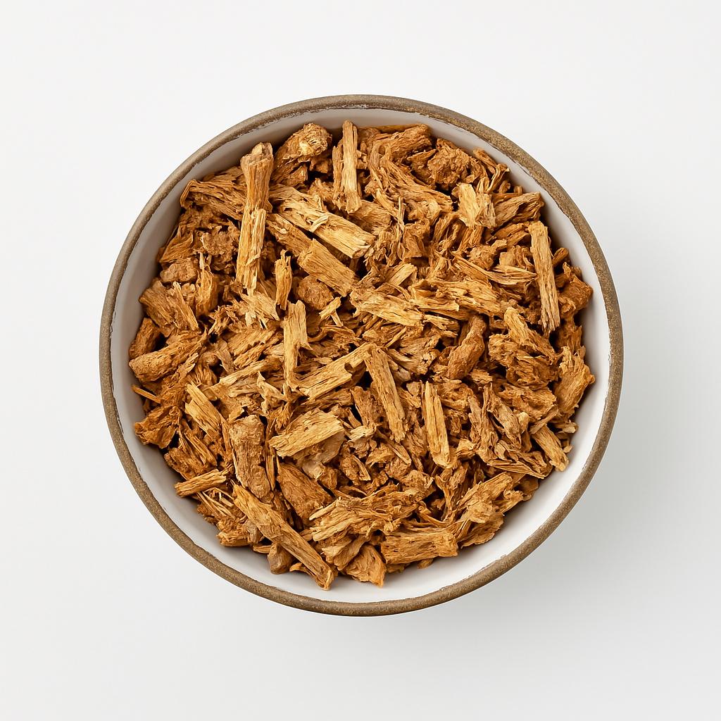 Top view of dried Borututu bark in a ceramic bowl on a light background – herbal root tea cut