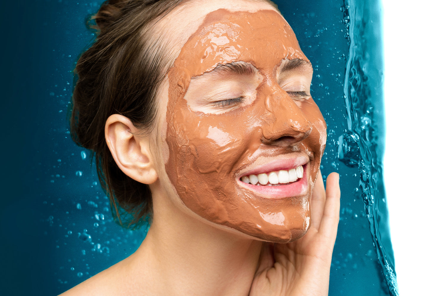 Woman with a Moroccan Rhassoul Ghassoul facial treatment mask 