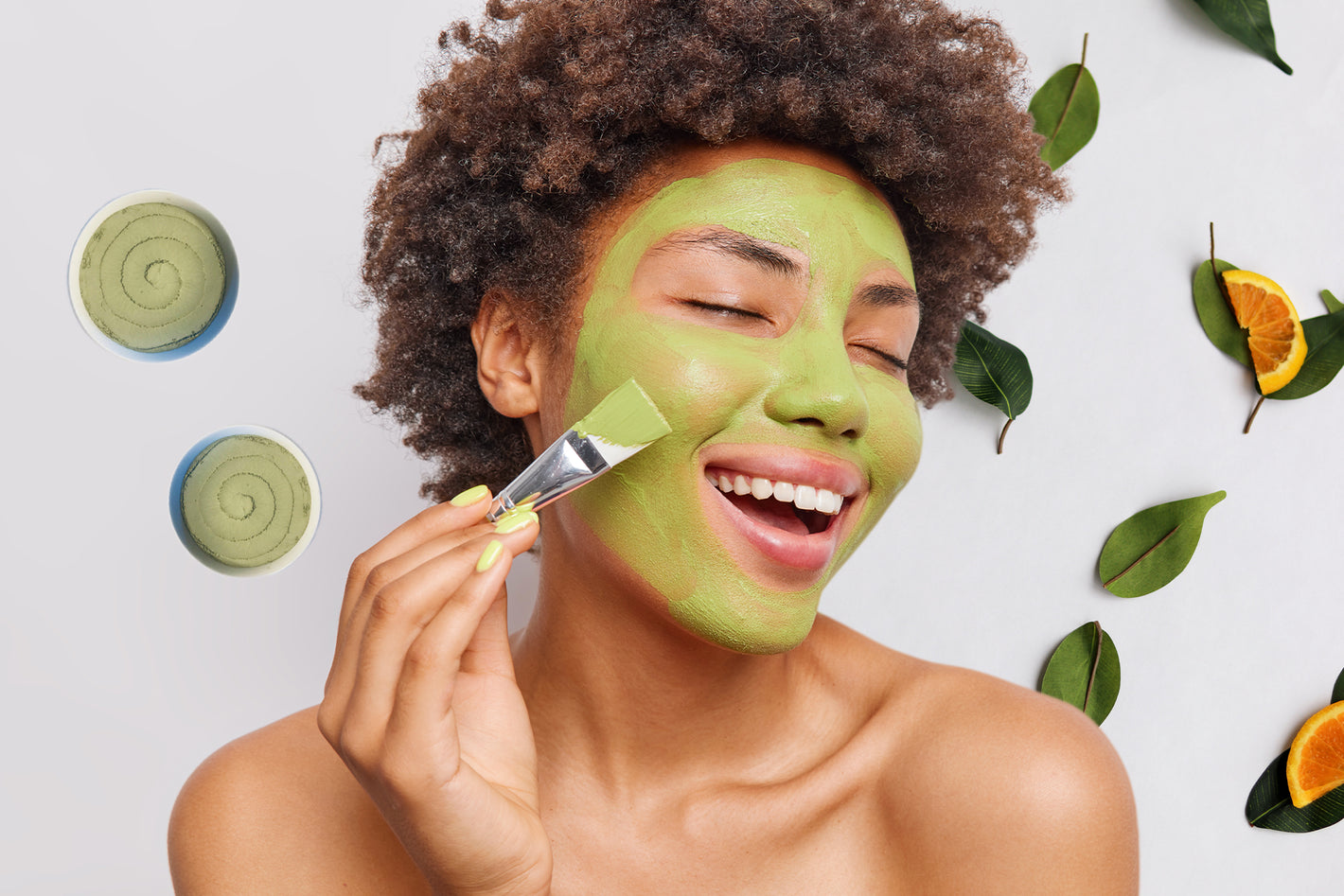 Green clay mask on a young lady's face